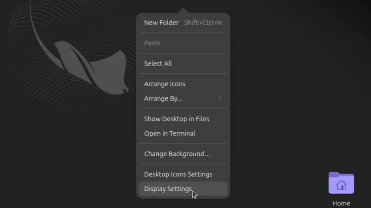 The desktop right-click menu with Display Settings at the bottom.