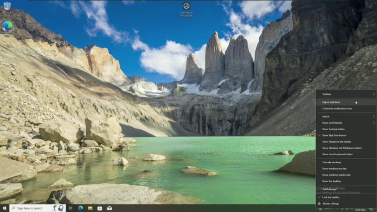 Right-clicking the Windows 10 taskbar clock and selecting Adjust date/time from the context menu