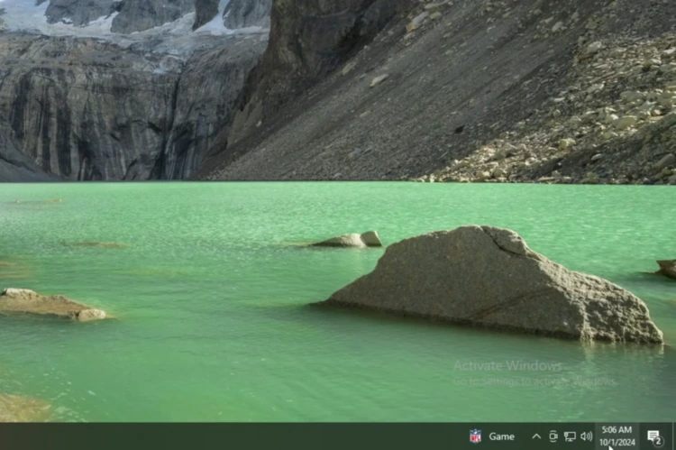 Windows 10 taskbar showing the corrected time of 5:06 AM and date of October 1, 2024 after syncing