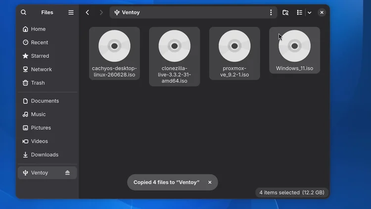 The Files app showing the Ventoy drive with four ISO files: cachyos, clonezilla, proxmox and Windows 11.