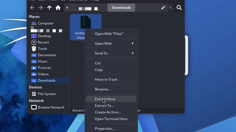 The file manager with the right-click menu open on the linux.tar.gz file and the pointer on Extract Here.