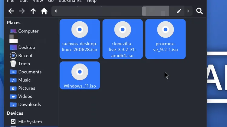 The file manager showing the Ventoy drive with four ISO files, cachyos, clonezilla, proxmox and Windows 11.